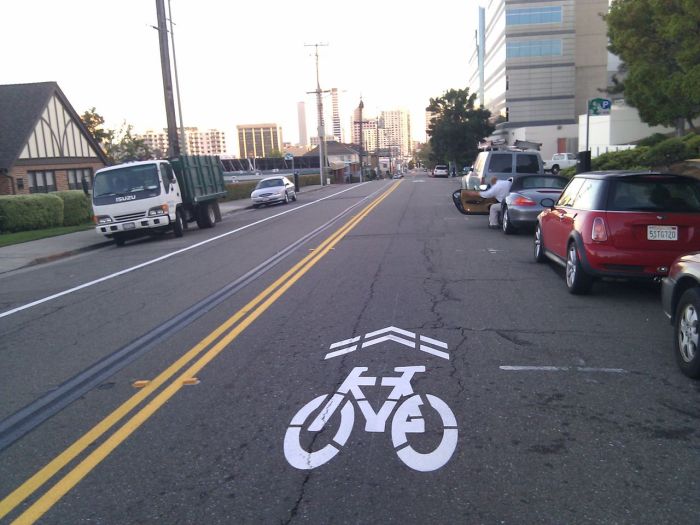 A sharrow designates a traffic lane that is